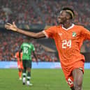 Ivory Coast's forward #24 Simon Adingra celebrates after Ivory Coast's forward #22 Sebastien Haller scored their team's second goal during the Africa Cup of Nations (CAN) 2024 final football match between Ivory Coast and Nigeria at Alassane Ouattara Olympic Stadium in Ebimpe, Abidjan on February 11, 2024. (Photo by Issouf SANOGO / AFP) (Photo by ISSOUF SANOGO/AFP via Getty Images)