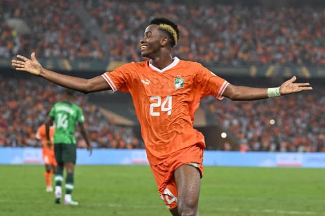 Ivory Coast's forward #24 Simon Adingra celebrates after Ivory Coast's forward #22 Sebastien Haller scored their team's second goal during the Africa Cup of Nations (CAN) 2024 final football match between Ivory Coast and Nigeria at Alassane Ouattara Olympic Stadium in Ebimpe, Abidjan on February 11, 2024. (Photo by Issouf SANOGO / AFP) (Photo by ISSOUF SANOGO/AFP via Getty Images)