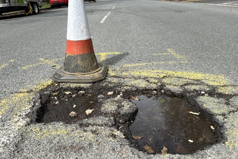 The potholes in Grand Avenue, Worthing have 'reached a critical level' - so residents have taken matters into their own hands by putting down cones