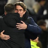 Brentford's Danish head coach Thomas Frank (R) and Brighton's Italian head coach Roberto De Zerbi (L) embrace at the Amex Stadium last December