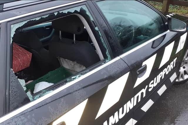 Thieves broke a side window of the car to gain entry