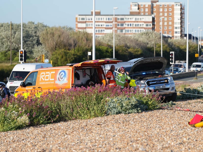 Police and the fire service helping at car on Worthing Beach on Monday evening, June 2