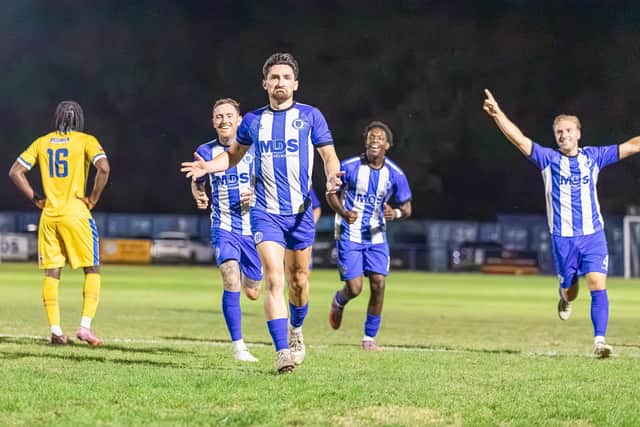 Haywards Heath Town celebrare the late FA Cup goal that got them through to this weekend's first qualifying round | James Geth