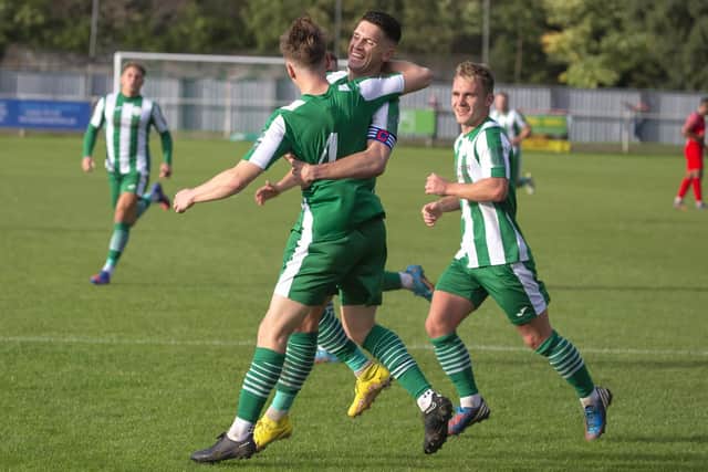 Celebrations for Chichester City on their way to winning against Hythe Town | Picture: Neil Holmes