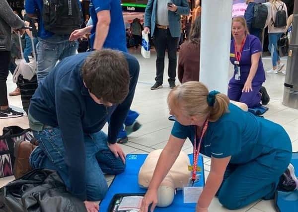 Passengers travelling through Gatwick Airport get taught the benefits of CPR by professionals from Surrey and Sussex Healthcare