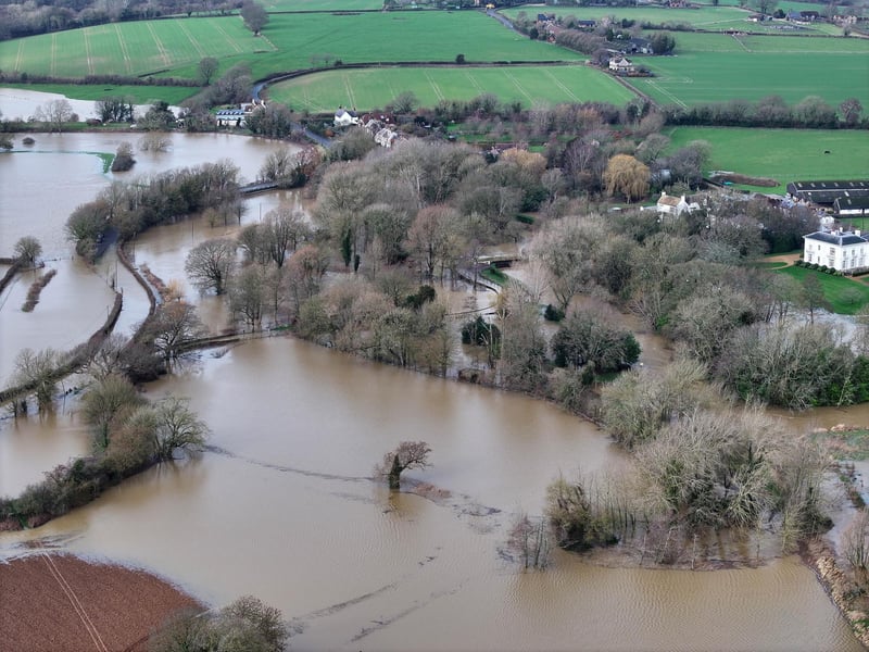 A road off the A26 remains closed following heavy rainfall last week which has submerged a village near Lewes.