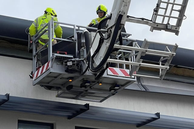 Firefighters using the aerial ladder platform at Worthing Hospital