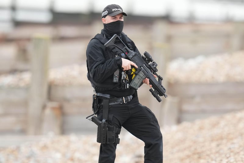 Photos have emerged from Ferring beach showing multiple police officers, carrying firearms.