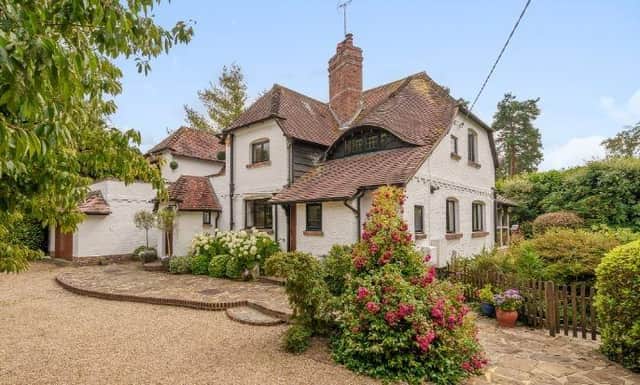 This four-bedroom property in West Chiltington has stunning gardens and a roof terrace. It is on sale with a guide price of £1,150,000
