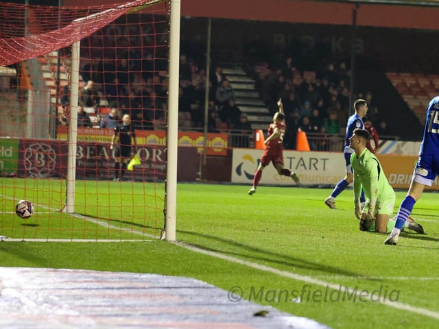 Charlie Barker celebrates his goal against Wigan as the all nestles in the back of the net