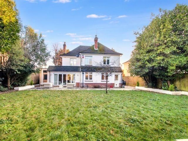 The back garden is mainly laid to lawn with established borders, a patio area and a variety of mature trees and shrubs