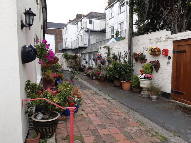 Floral splendour at Brunswick Cottages, a tiny courtyard of four fishermen's houses off the twitten that marks the historic boundary between Worthing and Heene