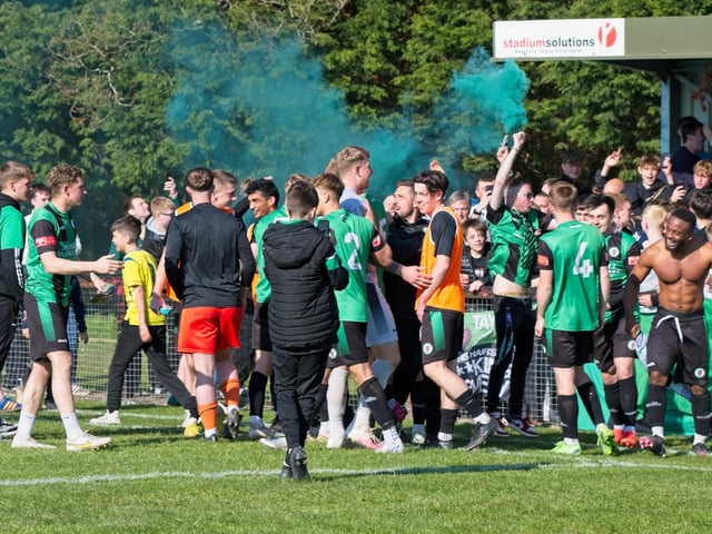 Burgess Hill Town players, fans and staff celebrate surviving in the Isthmian south east division at the end of their 0-0 draw with Beckenham