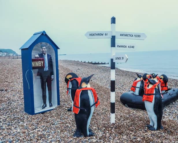 Penguin art installation on beach