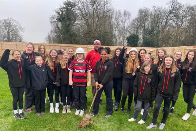 Haywards Heath RFC girls and 1st XV captain Wilf Bridges break ground for new clubhouse at Whitemans Green | Picture supplied by club