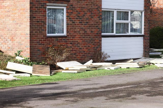 Debris from the roof of a block of flats in Gorse Avenue, Worthing, which was damaged by the Storm Eunice
