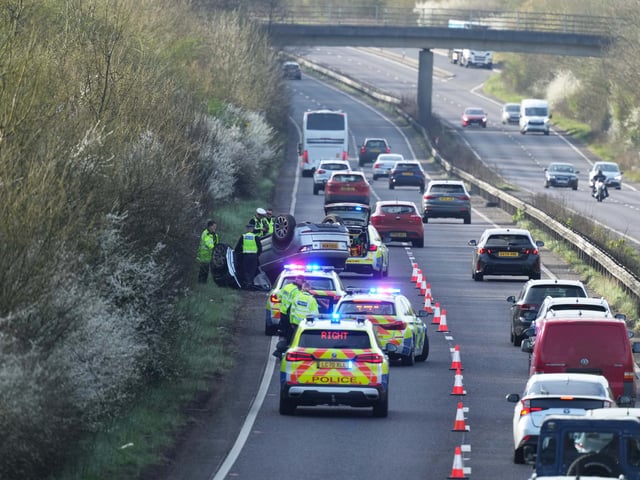 A woman has been arrested on suspicion of ‘driving while under the influence of alcohol and driving without a licence’ after overturning a vehicle on a major Sussex road.