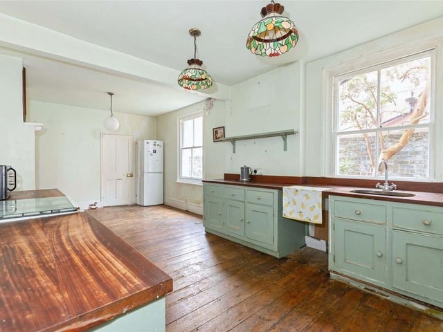 The kitchen/breakfast room leads to the utility room and garden access