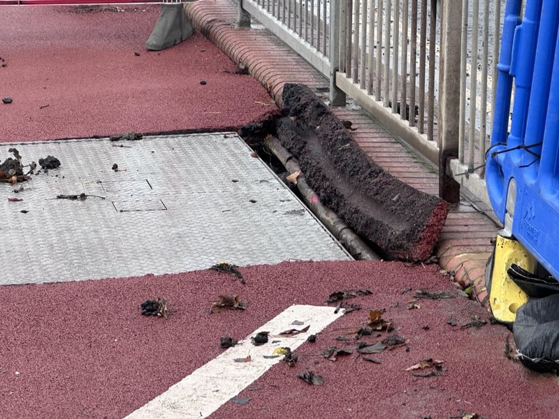 Part of the pavement on Hastings seafront has been damaged following torrential rain. Picture: John Bownas