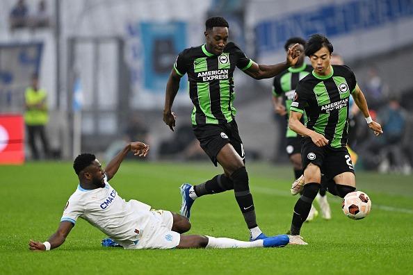 Chancel Mbemba of Marseille challenges Danny Welbeck and Kaoru Mitoma
