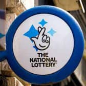 A mystery woman has scooped £155,132 on the National Lottery