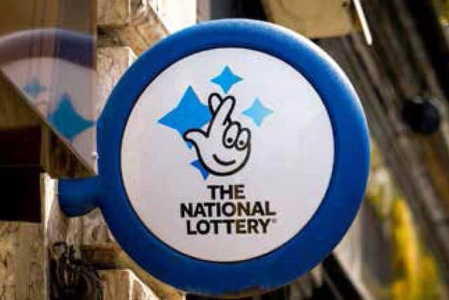 A mystery woman has scooped £155,132 on the National Lottery