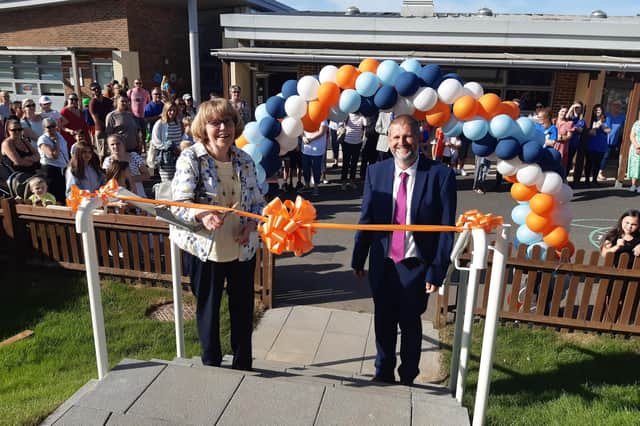 Mary McGregor with New Horizons Seaside Primary School head Lee Murley, cutting the ribbon to officially open the new sports hall in memory of mentor Peter McGregor. Photo by Elaine Hammond / Sussex World