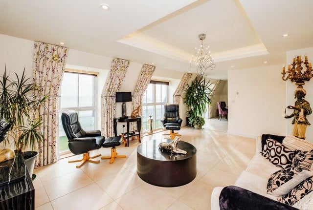 Inside is a bright, spacious living room.