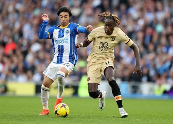 Kaoru Mitoma of Brighton & Hove Albion battles for possession with Trevoh Chalobah of Chelsea during the Premier League match