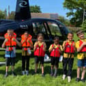 Holy Trinity C of E School pupils with the helicopter