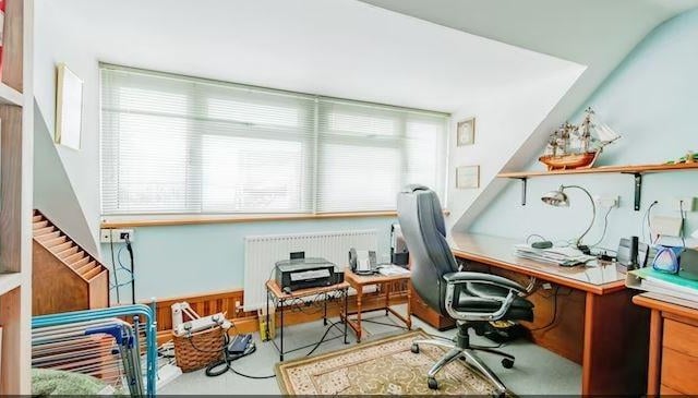 There is a study/bedroom with bespoke fitted furniture and views to the front of the house