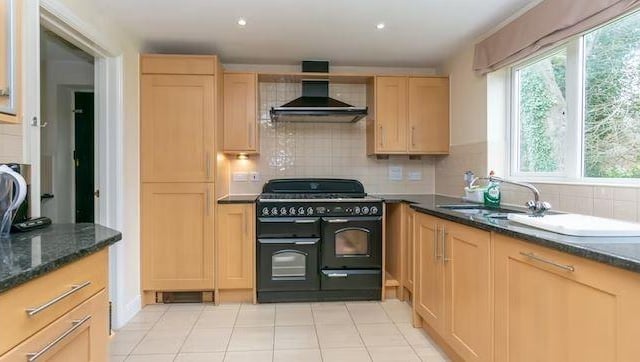 The kitchen/breakfast room is fitted in an extensive range of base and wall units with complementary working surfaces and integrated appliances.. There is a separate utility room with appliance space.