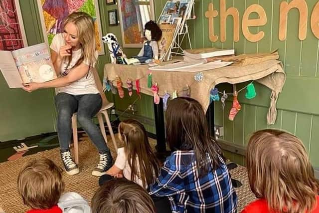 Author and illustrator Heather Stuart reading to Children at The Nest in Hastings Old Town