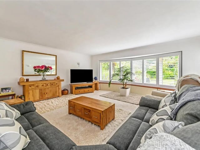 Thew bay windows give the living room a real sense of character