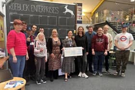 The team at Aspens' Roebuck Enterprises receive cheque from Ensemble Productions