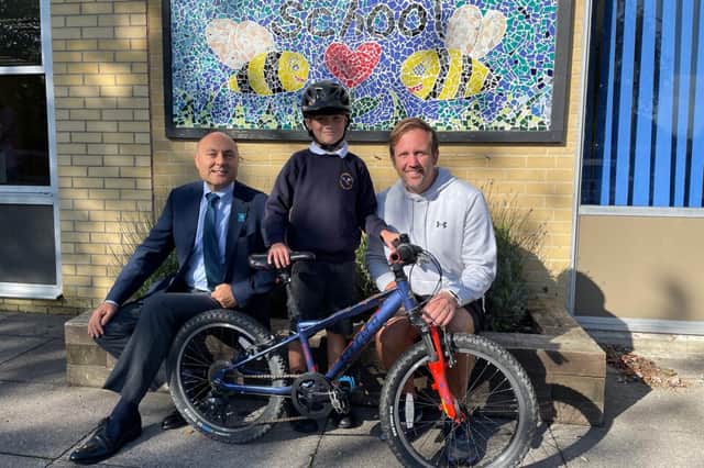 Andrew with young cyclist Rowan and Mr Trent at Aldingbourne Primary School