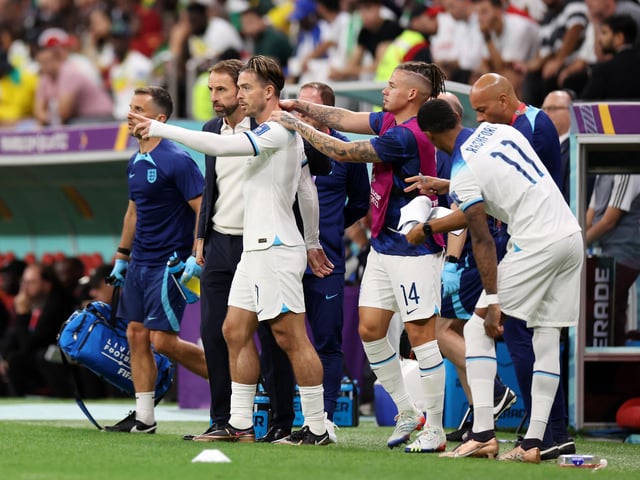 AL KHOR, QATAR - DECEMBER 04: Gareth Southgate, Head Coach of England, speaks with Jack Grealish before a substitution during the FIFA World Cup Qatar 2022 Round of 16 match between England and Senegal at Al Bayt Stadium on December 04, 2022 in Al Khor, Qatar. (Photo by Catherine Ivill/Getty Images)