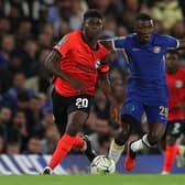 Brighton's Carlos Baleba (L) vies with Chelsea's Moises Caicedo in the Carabao Cup clash