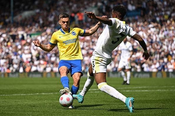 Brighton's Belgian midfielder Leandro Trossard (L) vies with Leeds United's Spanish defender Junior Firpo (R) during the English Premier League football match between Leeds United and Brighton and Hove Albion at Elland Road in Leeds, northern England on May 15, 2022. - RESTRICTED TO EDITORIAL USE. No use with unauthorized audio, video, data, fixture lists, club/league logos or 'live' services. Online in-match use limited to 120 images. An additional 40 images may be used in extra time. No video emulation. Social media in-match use limited to 120 images. An additional 40 images may be used in extra time. No use in betting publications, games or single club/league/player publications. (Photo by Oli SCARFF / AFP) / RESTRICTED TO EDITORIAL USE. No use with unauthorized audio, video, data, fixture lists, club/league logos or 'live' services. Online in-match use limited to 120 images. An additional 40 images may be used in extra time. No video emulation. Social media in-match use limited to 120 images. An additional 40 images may be used in extra time. No use in betting publications, games or single club/league/player publications. / RESTRICTED TO EDITORIAL USE. No use with unauthorized audio, video, data, fixture lists, club/league logos or 'live' services. Online in-match use limited to 120 images. An additional 40 images may be used in extra time. No video emulation. Social media in-match use limited to 120 images. An additional 40 images may be used in extra time. No use in betting publications, games or single club/league/player publications. (Photo by OLI SCARFF/AFP via Getty Images)