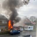 Flames leapt out of a garage at a property in Sycamore Avenue, Horsham, setting a parked car on fire. Photo: Caroline Hoets