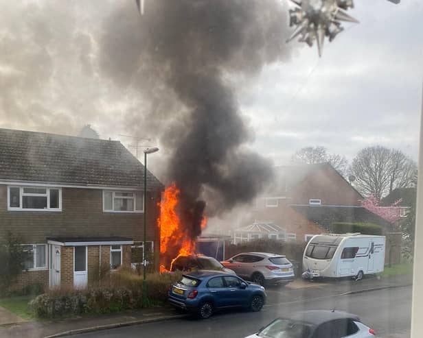 Flames leapt out of a garage at a property in Sycamore Avenue, Horsham, setting a parked car on fire. Photo: Caroline Hoets