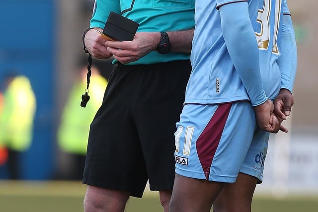 Referee Graham Salisbury takes the name of Jennison Myrie-Williams of Tranmere Rovers.