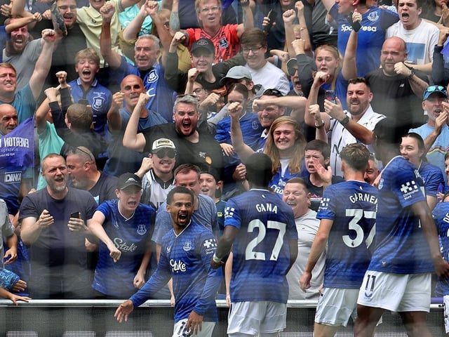 Everton's Senegalese striker #10 Iliman Ndiaye (L) celebrates scoring the opening goal during the English Premier League football match between Everton and Brighton and Hove Albion at Hill Dickinson Stadium