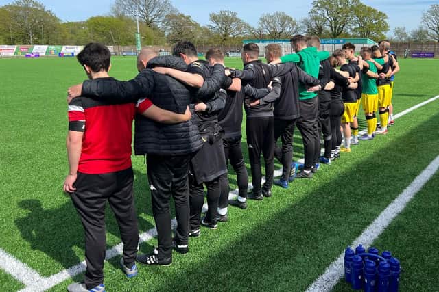 Chi City's staff and players pay a pre-match tribute to Graeme Gee | Picture: Lewis McKenzie