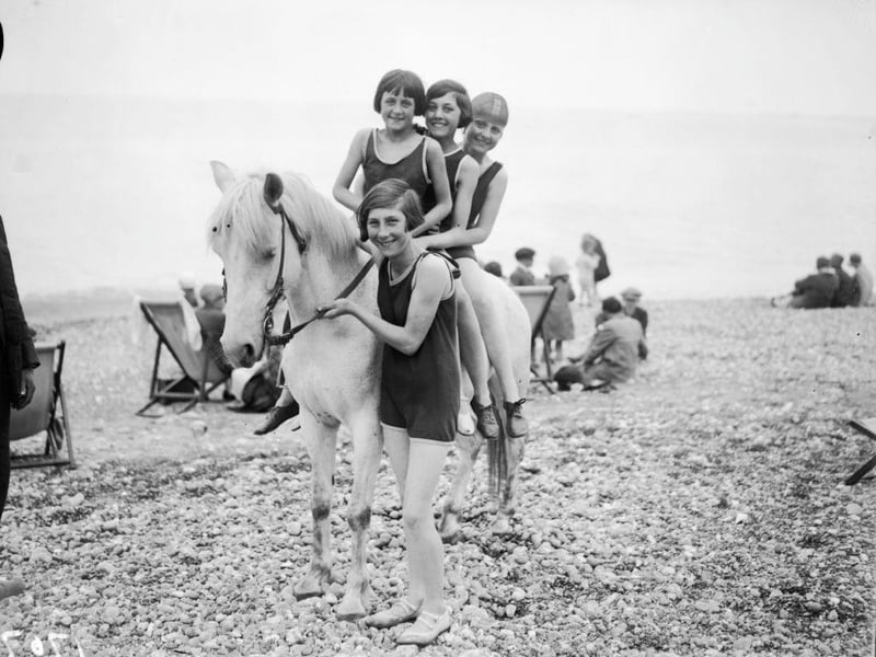 Girls riding a pony on the beach at Hastings in June 1929.