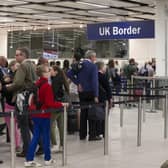 Border Force check the passports of passengers arriving at Gatwick Airport  (Photo by Oli Scarff/Getty Images)