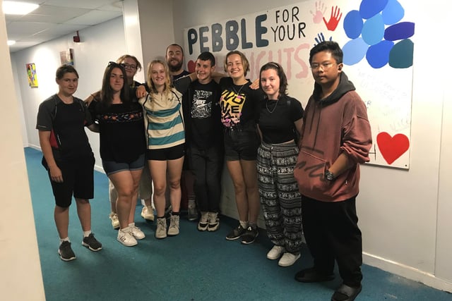The Pebble For Your Thoughts team of students with their mural