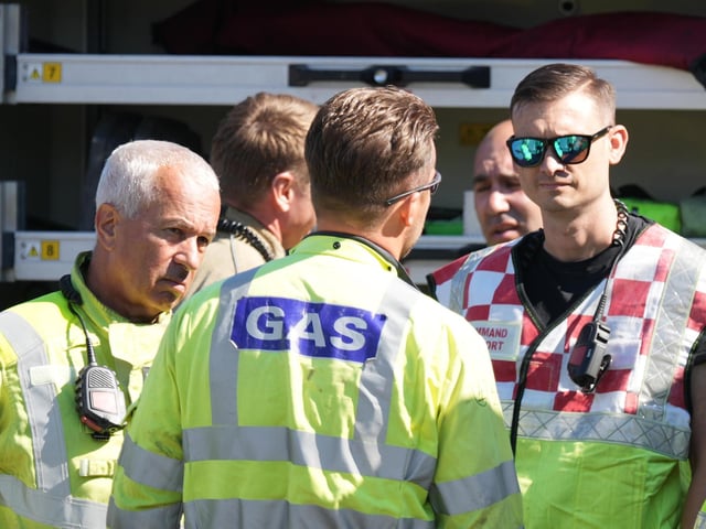 Officials outside the shopping centre