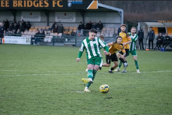 Josh Clack scores from the spot for Chichester City at Three Bridges | Picture: Neil Holmes