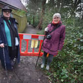 L-R: Valerie Myers and Christine Giles from Save Old Roar Gill. Pictured by the closed pathway at the top of Old Roar Road.